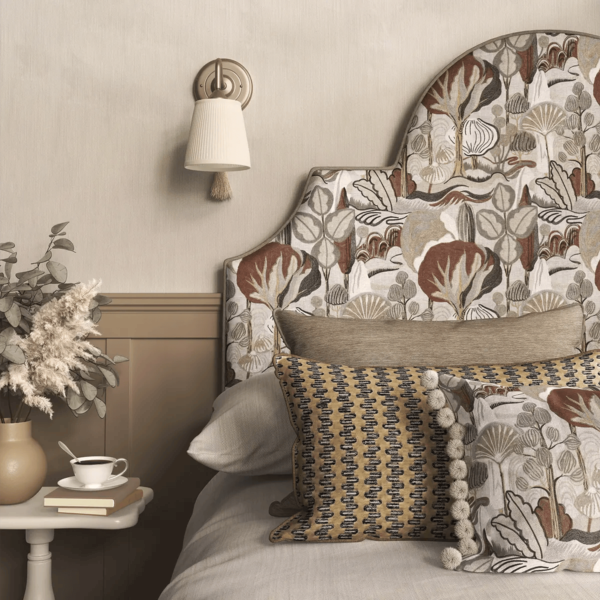 Close-up of a bed with decorative cushions and a textured upholstered headboard