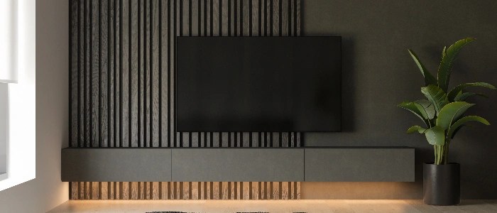 Custom TV media unit with wood paneling and hidden wires.