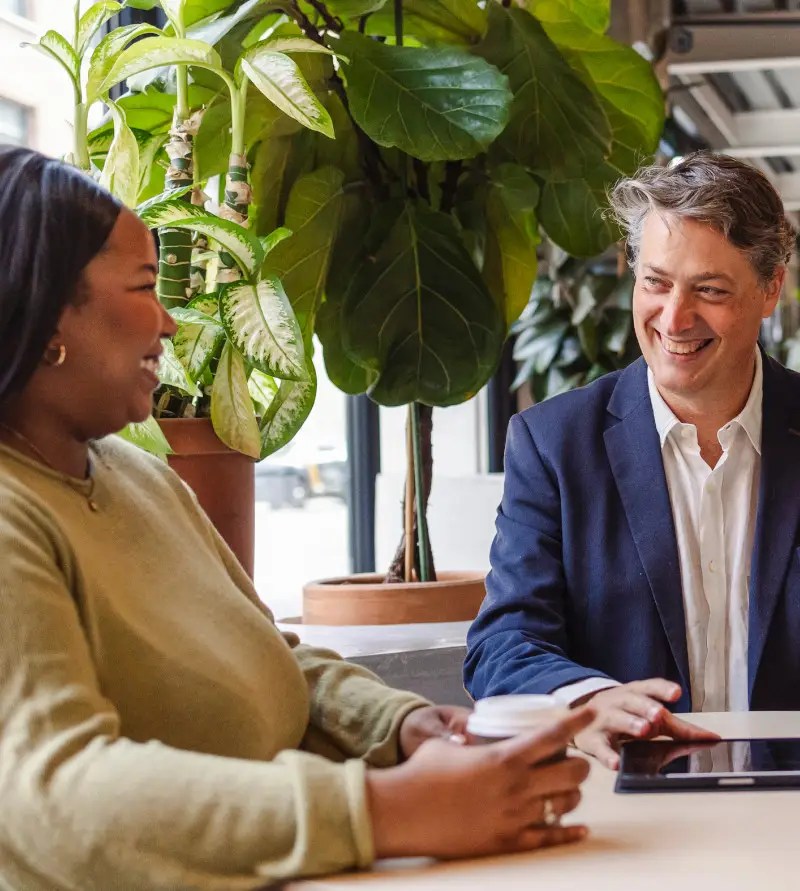Business people having a meeting using tablet in modern office