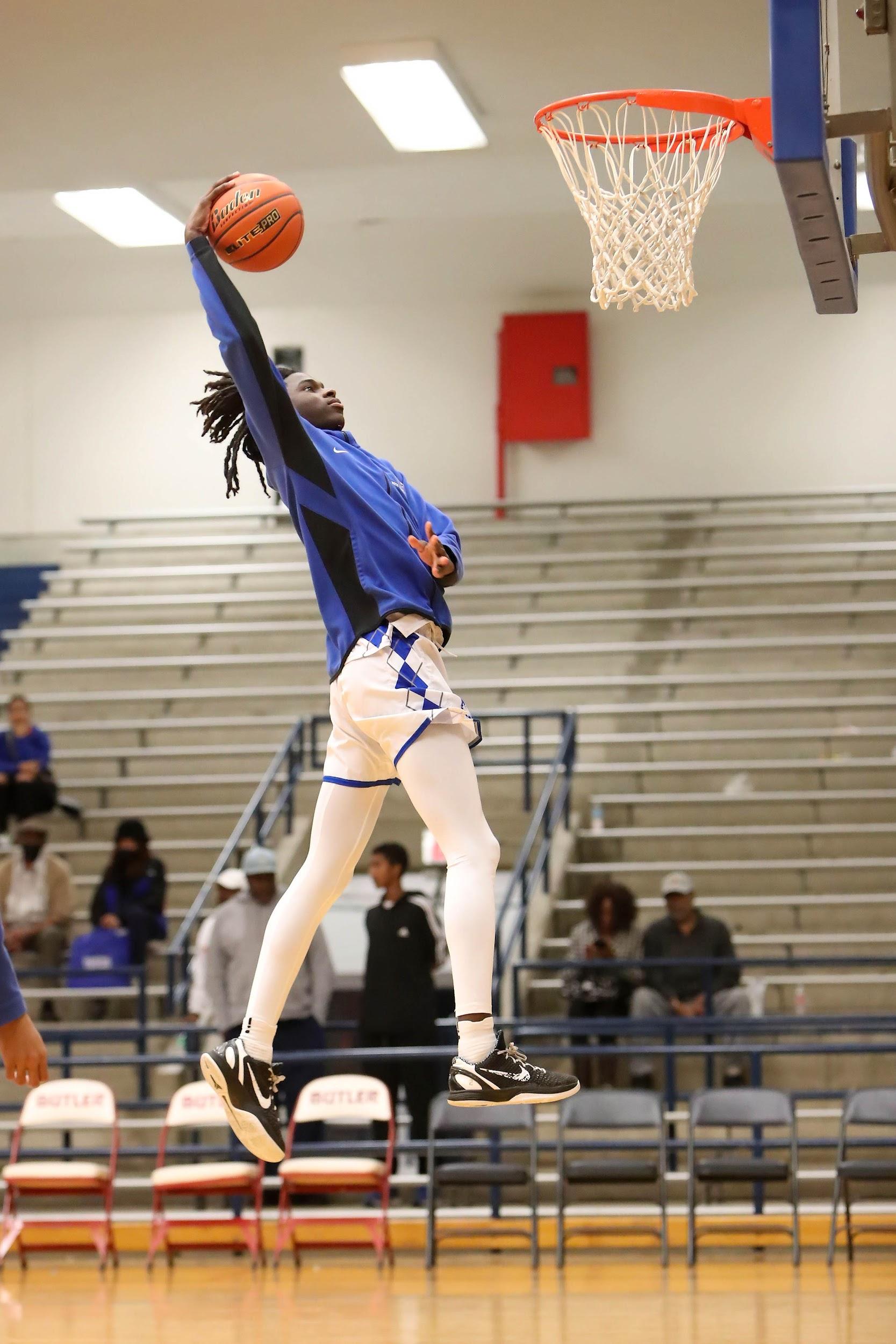 HOUSTON, TX - FEBRUARY 10: Westbury guard Fareed Allim (2) advances the ball up the court past a Westside High School defender at Butler Stadium in Houston, TX