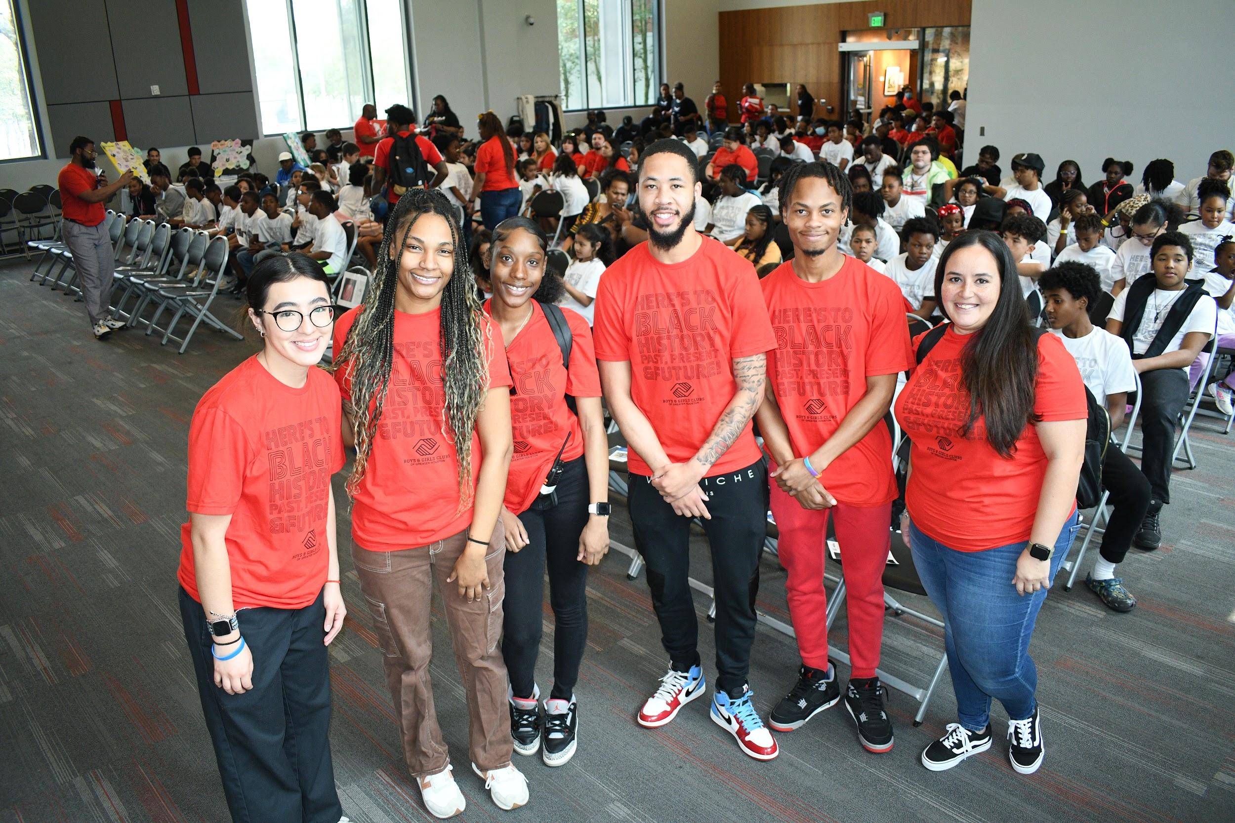 Boys & Girls Club of Greater Houston counselors with Black History Month program attendees behind them just minutes before the festivities kicked off.
