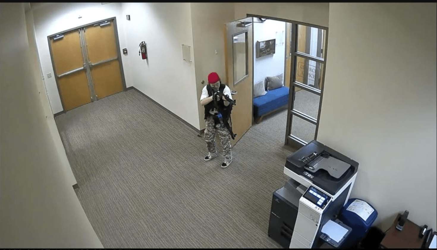 In this screen grab from surveillance video tweeted by the Metropolitan Nashville Police Department, Audrey Elizabeth Hale points an assault-style weapon inside The Covenant School in Nashville, Tenn.