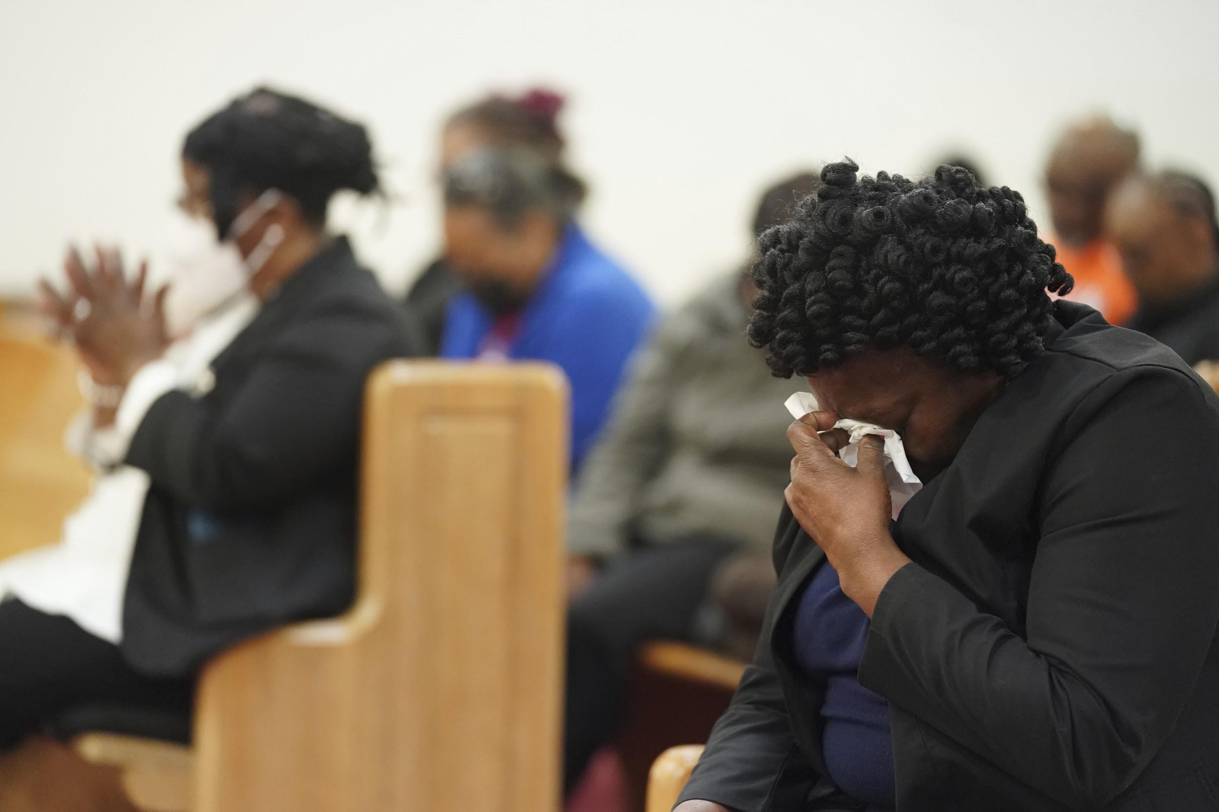 Elder Sharon Hammond uses a tissue during a vigil for a group of Americans recently kidnapped in Mexico, at Word of God Ministries in Scranton, S.C., Wednesday, March 8, 2023.