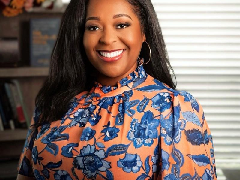 Portrait of Errica Dotson in a floral print blouse
