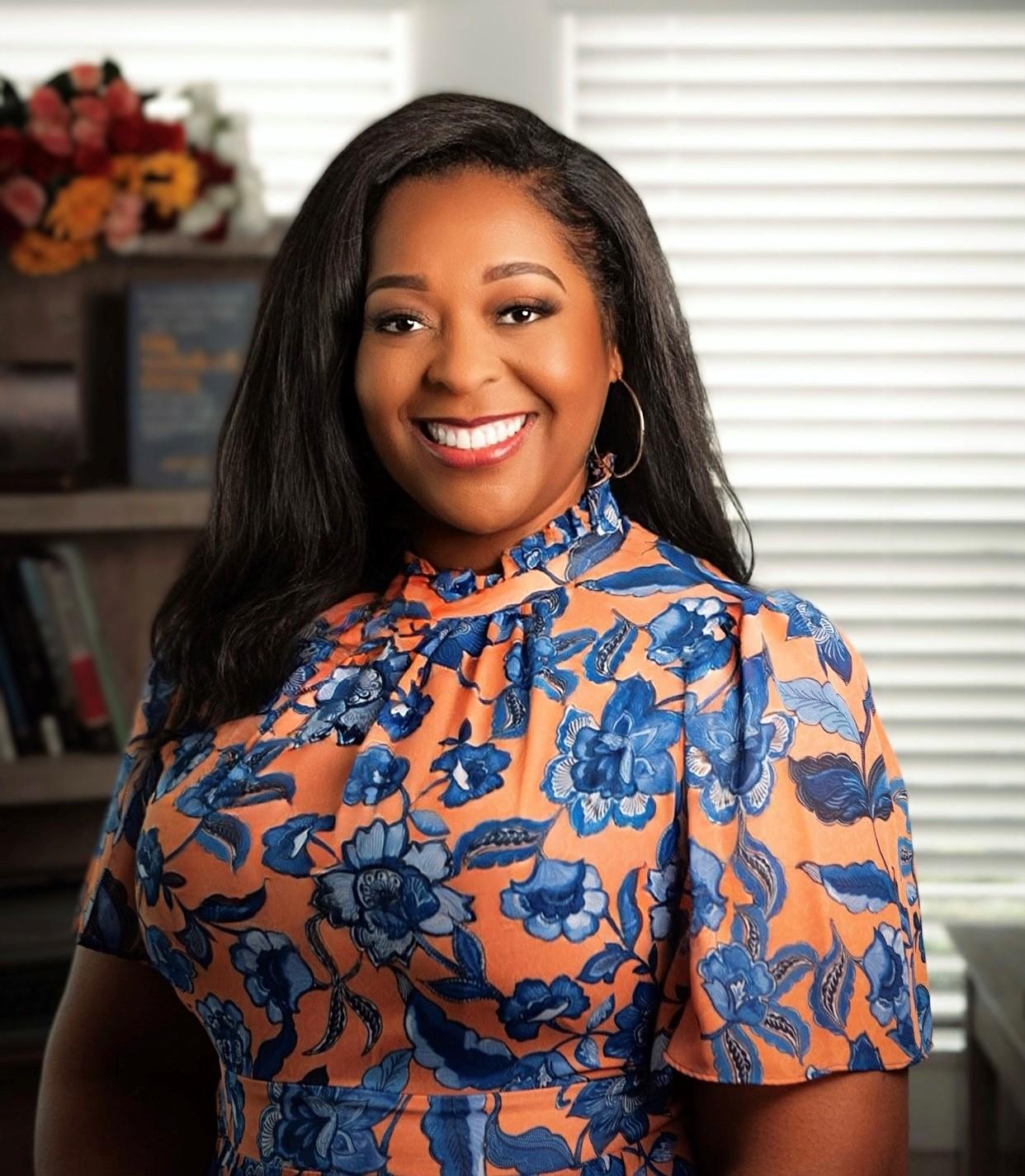 Portrait of Errica Dotson in a floral print blouse