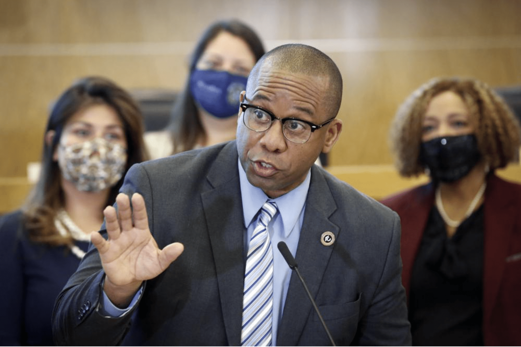 HISD Superintendent Millard House II shown answering questions from the media.