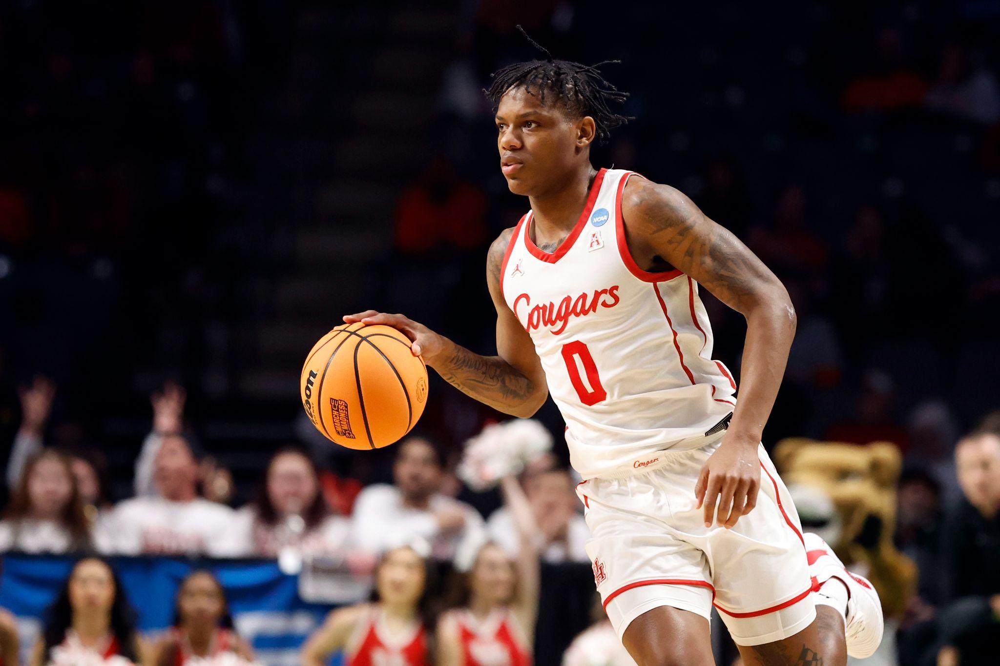 University of Houston All-American guard Marcus Sasser dribbles a basketball during a game.