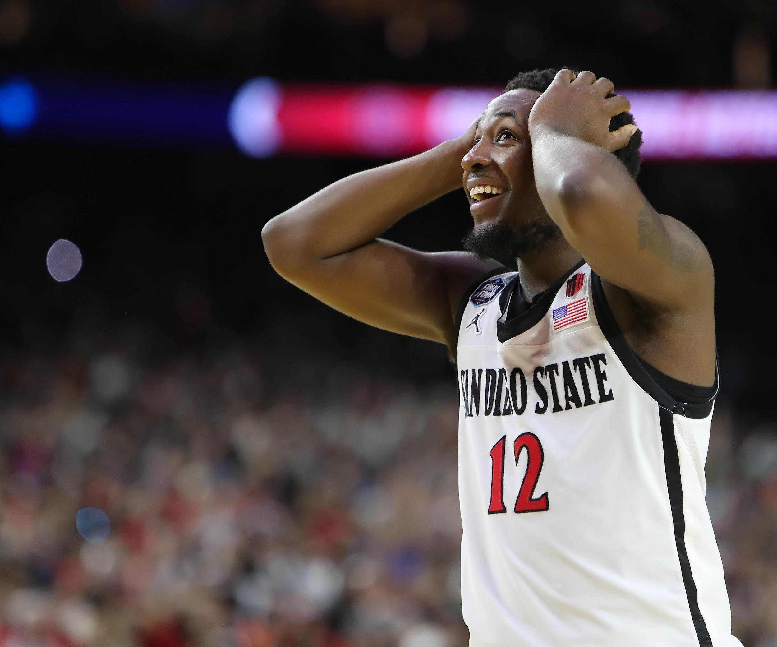 San Diego State University player grabs head in frustration during a game