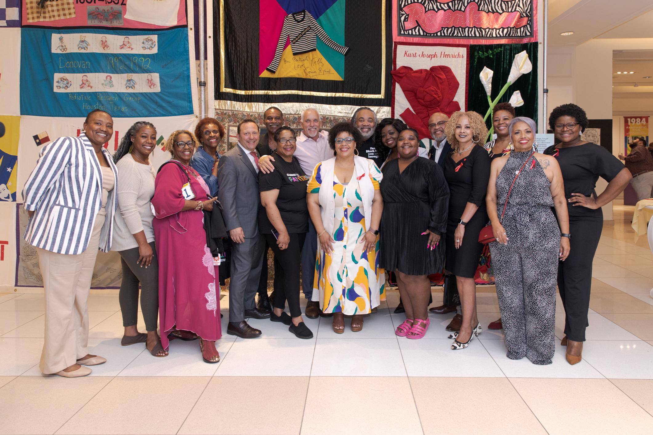 Members of Change the Pattern and sponsors pose in The Modern Art Gallery