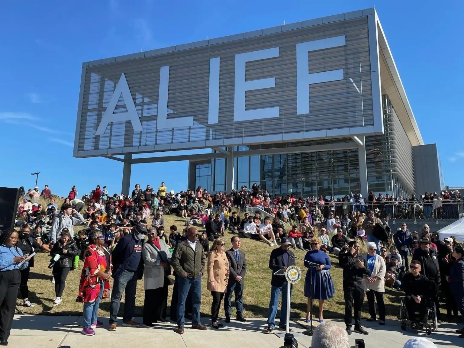 Mayor Sylvester Turner (center, at podium) and City Councilmember Tiffany Thomas address the huge crowd gathered to celebrate the Jan. 2023 Alief Neighborhood Center open house.