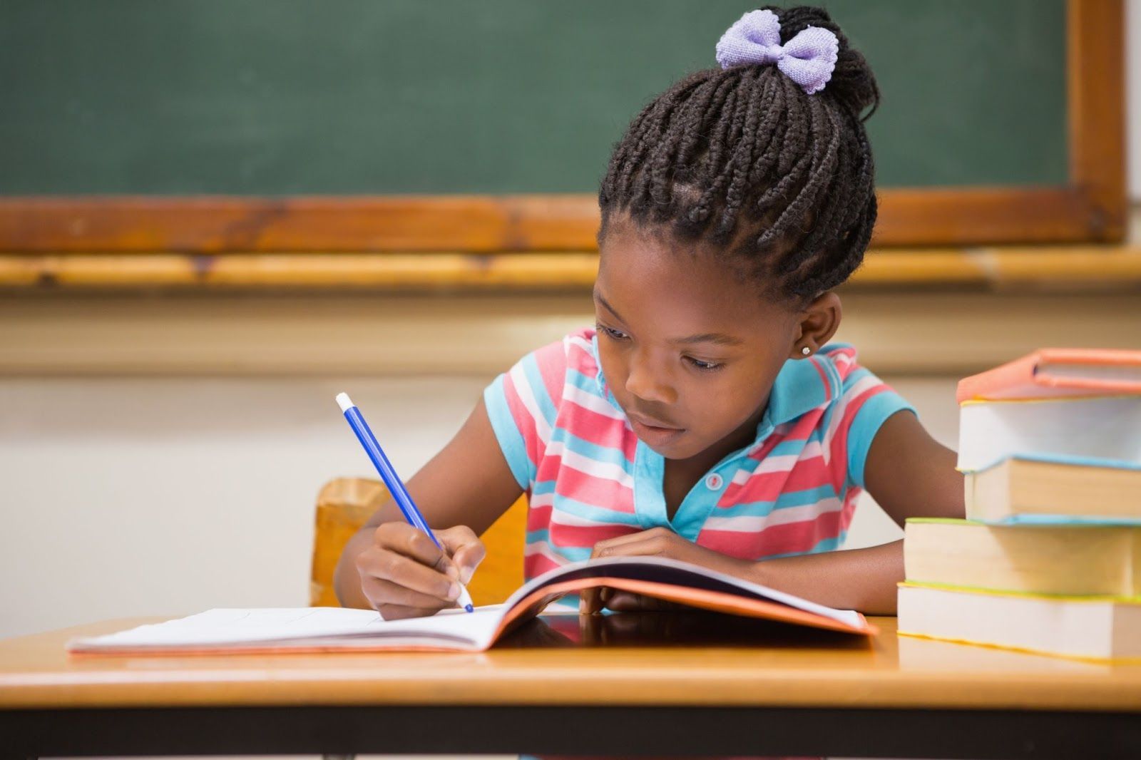 Pupil sitting at her desk