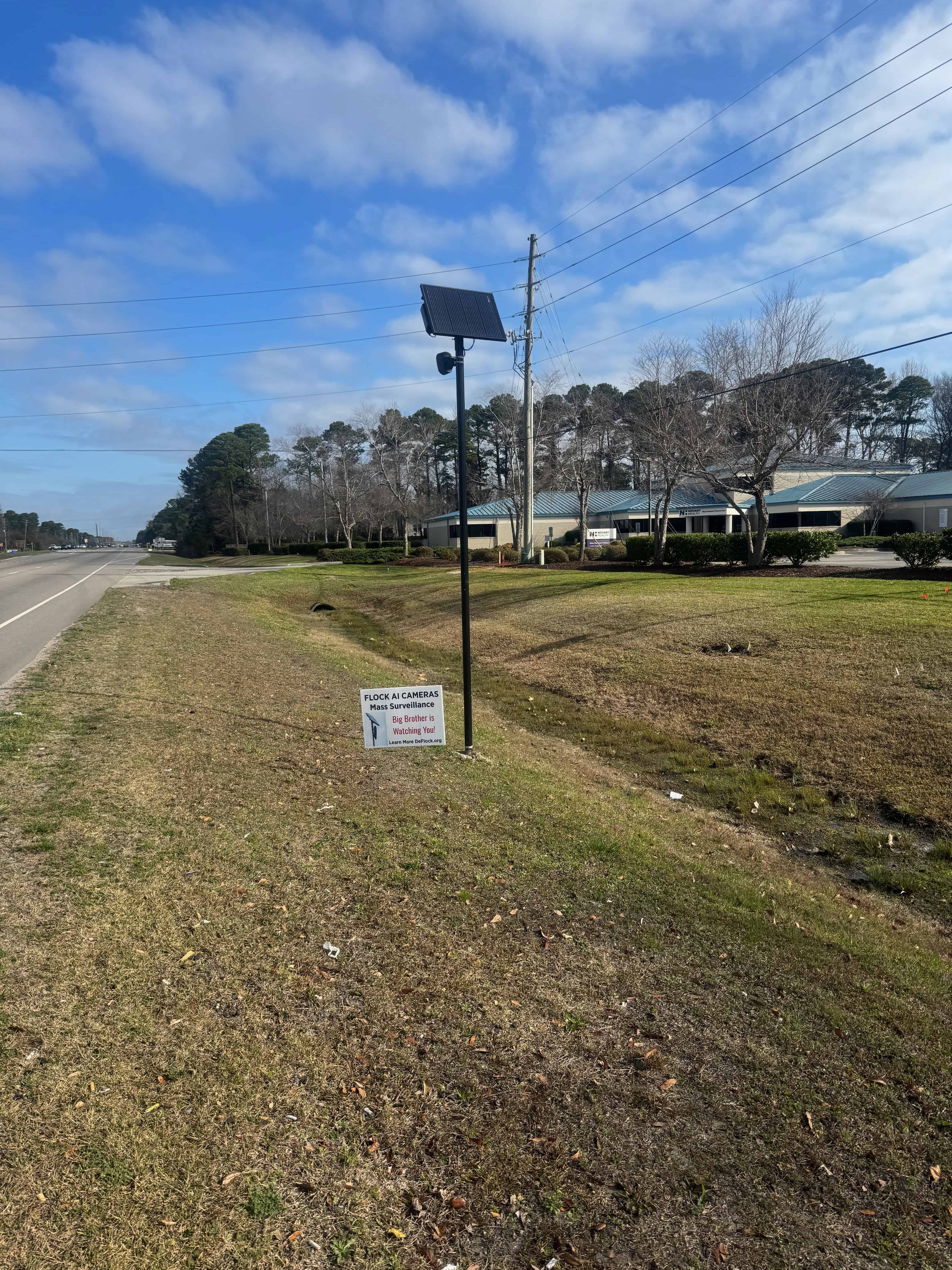 Standalone solar-powered Flock camera along South College Road in Wilmington