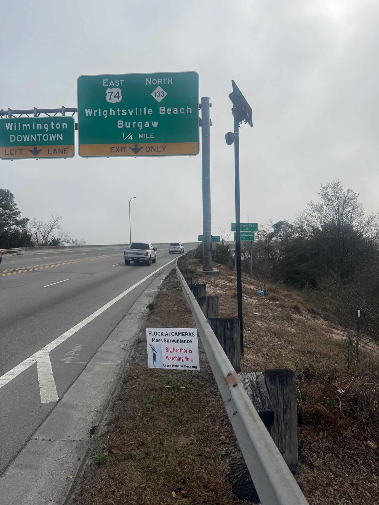 A Flock license-plate camera on the US 74 / NC 133 bridge into Wilmington