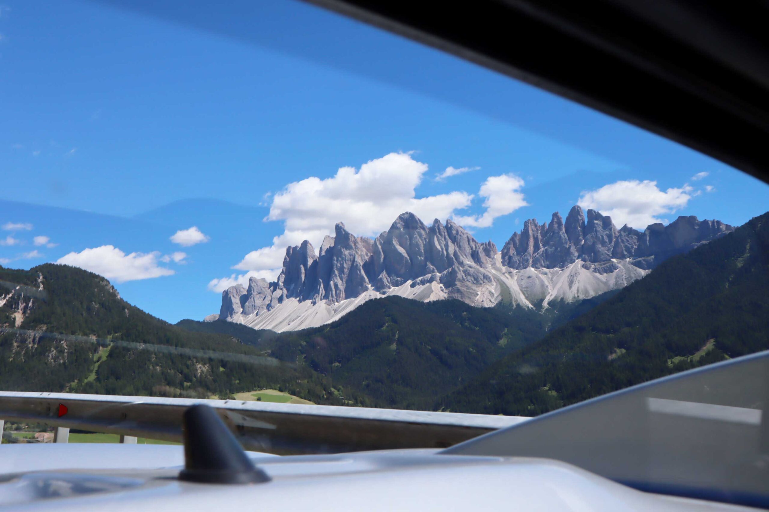 View of the mountain in the rear mirror of the Lotus Elise