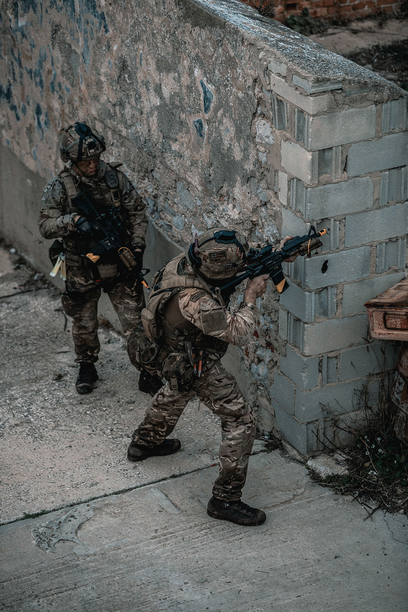 ROYAL MARINES OF 43 COMMANDO TRAIN ON THE FAMOUS ROCK OF GIBRALTAR Pictured: Royal Marines of P Squadron, 43 Commando, conduct an assault on the small urban area as part of the final phase of their training in Gibraltar. The action included a night time vertical assault and dawn attack followed by an abseil extraction back down the Rock of Gibraltar. Royal Marines from Scotland-based 43 Commando Fleet Protection Group have taken part in demanding training exercises on, and within, the Rock of Gibraltar, perfecting techniques they use in their top-secret mission as the elite guardians of the United Kingdoms strategic nuclear deterrent. Over 80 of these highly trained Commandos spent 2 weeks in early November on Exercise Serpent Rock honing the skills necessary for their no-fail mission protecting the Nations nuclear assets. This annual exercise sees the Royal Marines making best use of Gibraltars unique terrain, undertaking amphibious and cliff assaults, close quarter battle in urban environments and within the network of tunnels the Rock is famous for, as well as patrolling its streets, thoroughfares and the narrow alleyways and passages that pepper this British overseas territory.