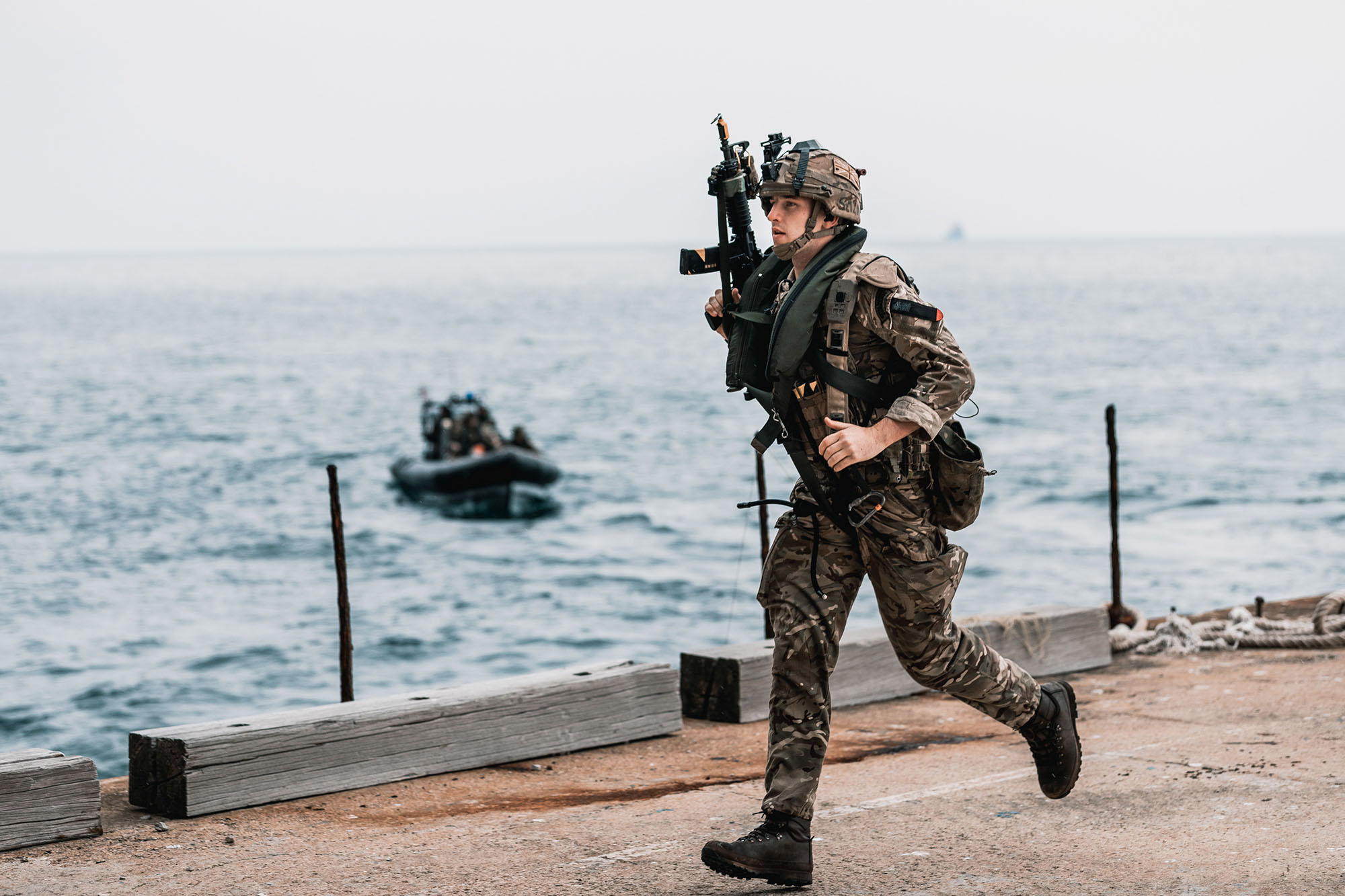 ROYAL MARINES OF 43 COMMANDO TRAIN ON THE FAMOUS ROCK OF GIBRALTAR Pictured: Royal Marines of P Squadron, 43 Commando, insert via landing craft onto a jetty at the base of the Gibraltar Rock before navigating a series of cave complexes in order to reach an objective within the Rock itself. Royal Marines from Scotland-based 43 Commando Fleet Protection Group have taken part in demanding training exercises on, and within, the Rock of Gibraltar, perfecting techniques they use in their top-secret mission as the elite guardians of the United Kingdom’s strategic nuclear deterrent. Over 80 of these highly trained Commandos spent 2 weeks in early November on Exercise Serpent Rock honing the skills necessary for their no-fail mission protecting the Nation’s nuclear assets. This annual exercise sees the Royal Marines making best use of Gibraltar’s unique terrain, undertaking amphibious and cliff assaults, close quarter battle in urban environments and within the network of tunnels the Rock is famous for, as well as patrolling its streets, thoroughfares and the narrow alleyways and passages that pepper this British overseas territory.