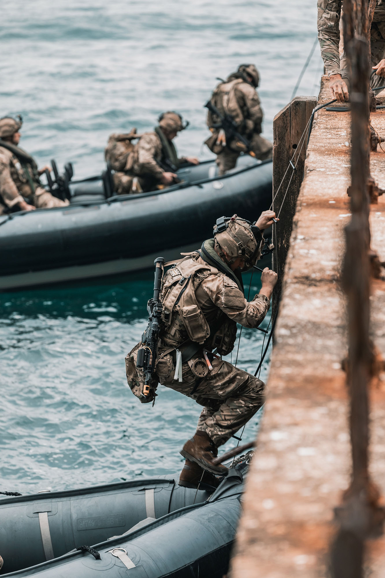 ROYAL MARINES OF 43 COMMANDO TRAIN ON THE FAMOUS ROCK OF GIBRALTAR Pictured: Royal Marines of P Squadron, 43 Commando, insert via landing craft onto a jetty at the base of the Gibraltar Rock before navigating a series of cave complexes in order to reach an objective within the Rock itself. Royal Marines from Scotland-based 43 Commando Fleet Protection Group have taken part in demanding training exercises on, and within, the Rock of Gibraltar, perfecting techniques they use in their top-secret mission as the elite guardians of the United Kingdoms strategic nuclear deterrent. Over 80 of these highly trained Commandos spent 2 weeks in early November on Exercise Serpent Rock honing the skills necessary for their no-fail mission protecting the Nations nuclear assets. This annual exercise sees the Royal Marines making best use of Gibraltars unique terrain, undertaking amphibious and cliff assaults, close quarter battle in urban environments and within the network of tunnels the Rock is famous for, as well as patrolling its streets, thoroughfares and the narrow alleyways and passages that pepper this British overseas territory.