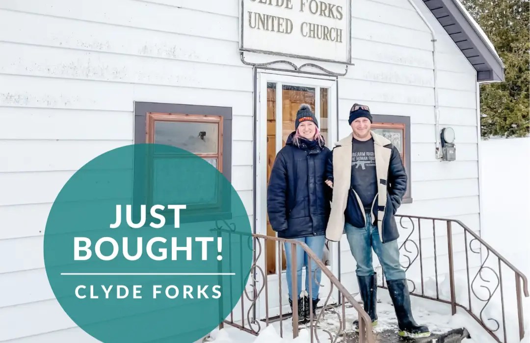 a couple standing in front of their new home in Ottawa