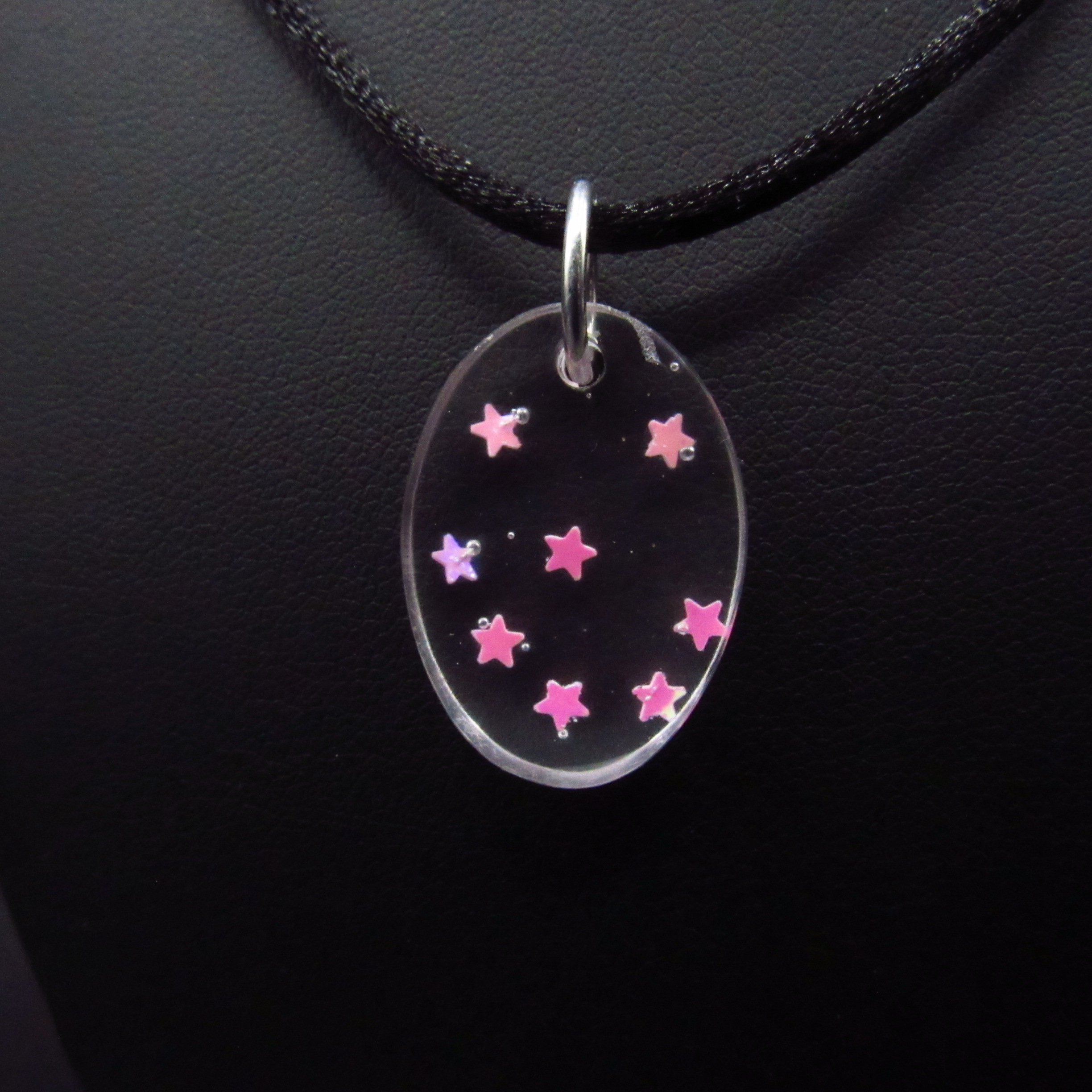 [Item # 1074] Small clear oval with pink stars