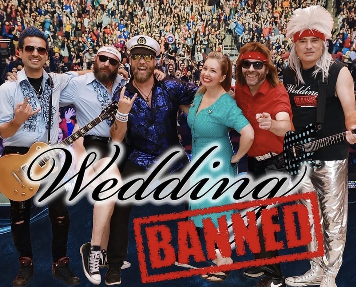 6 people in a variety of costumes (including sea captain, hair metal rocker, and nurse) pose side-by-side before a large crowd. Two of the members are holding electric guitars. The band logo, the word "Wedding" in cursive followed by a red-stamped "Banned," appears below them.