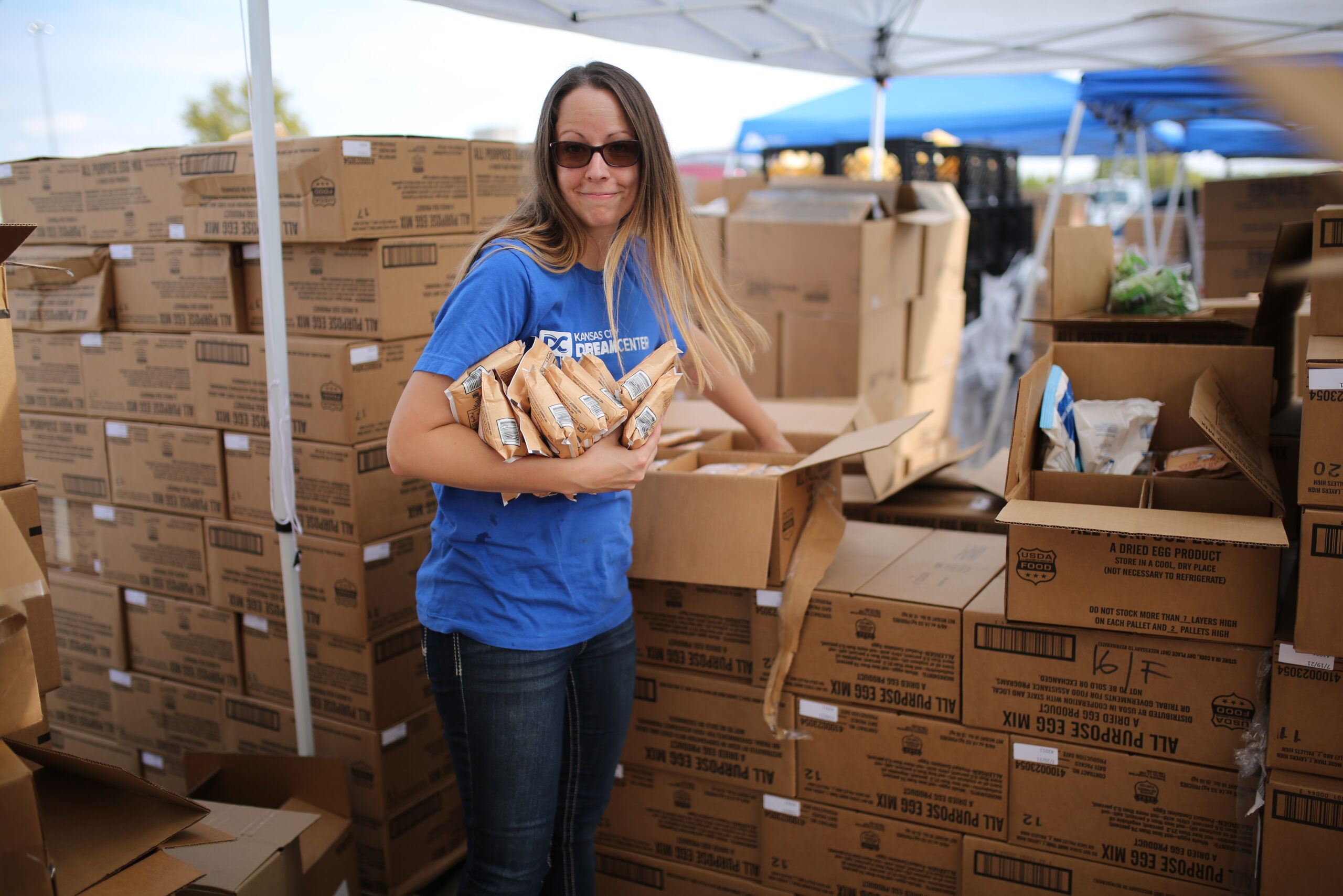Volunteer sorting food at a Mobile Food Distribution event.