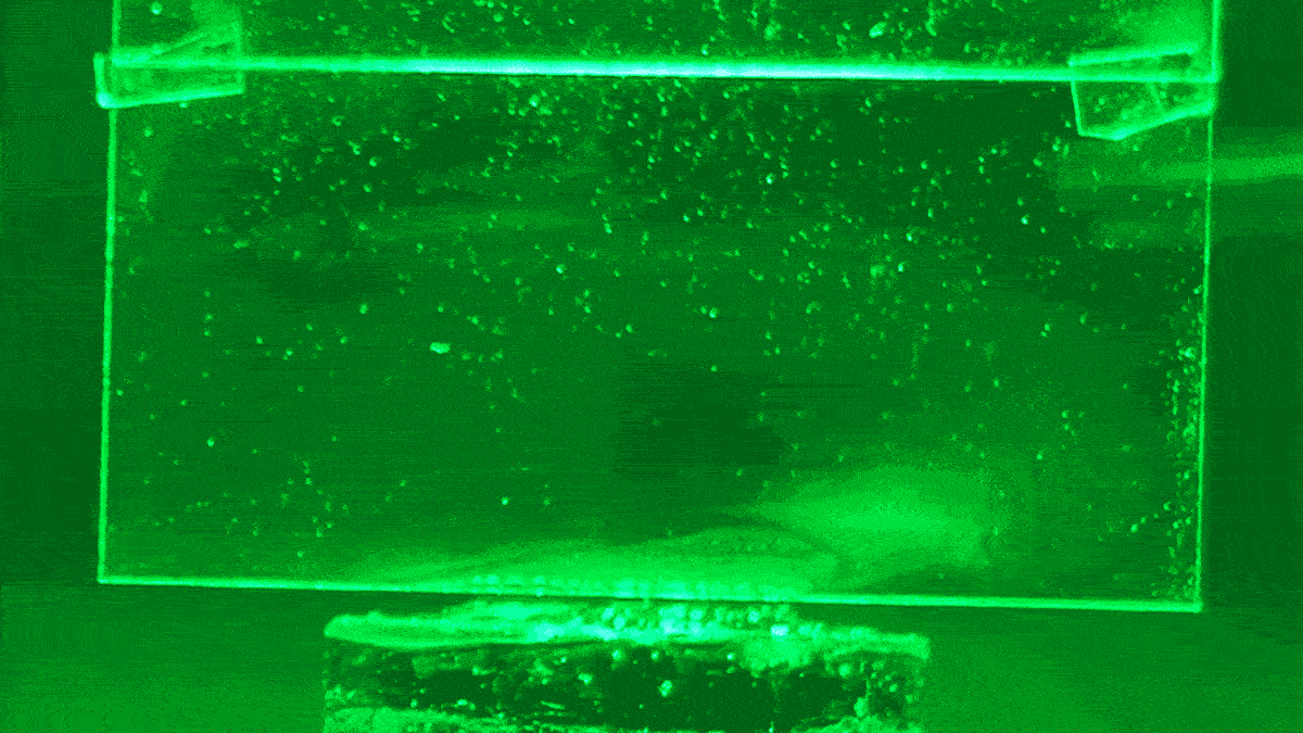 The puffs of white condensation on glass is water being evaporated from a hydrogel using green light, without heat.