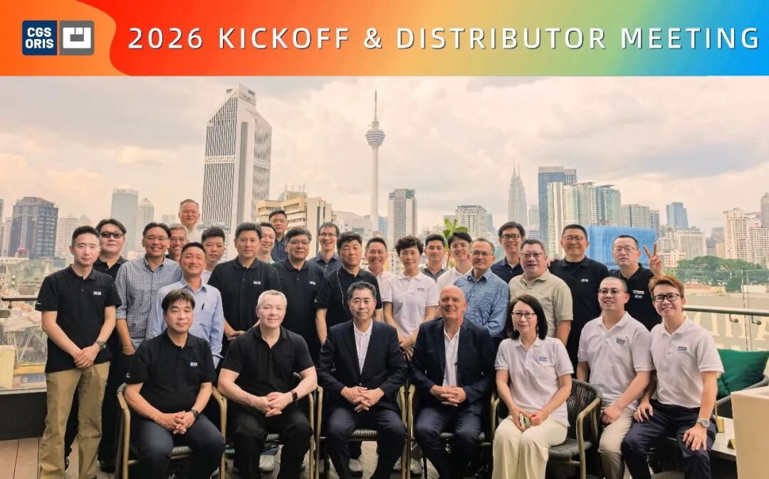 Group photo of attendees at the 2026 Kickoff & Distributor Meeting on a rooftop with city skyline in the background and the event banner above.