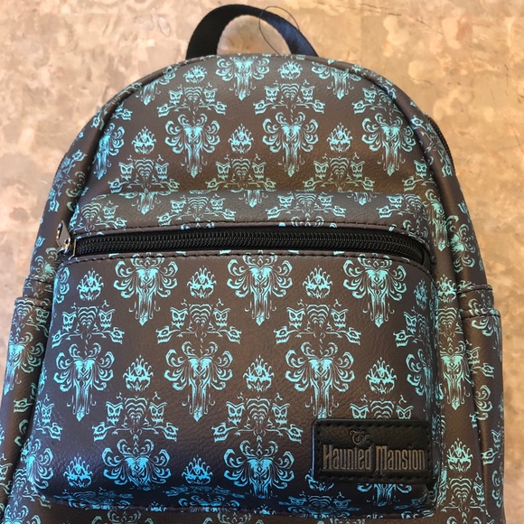 Its faux leather and denim design is covered in ghoulish artwork and warnings inspired by the haunted mansion attraction, plus it has a chain shoulder strap and detailing to rattle the nerves of ''foolish mortals.'' Loungefly Bags | Haunted Mansion Backpack | Poshmark