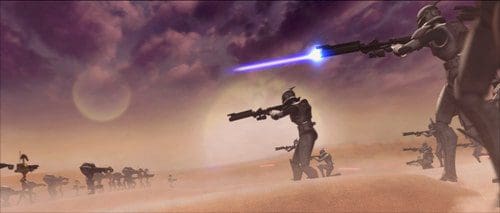 A group of futuristic soldiers firing energy weapons in a sandy landscape under a dramatic sky. The scene depicts several soldiers aiming, with a bright blue beam visible, and distant silhouettes of more figures in the background.