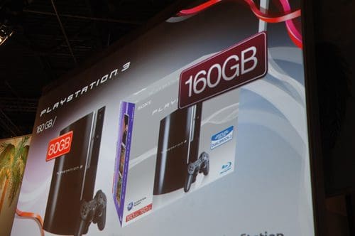 A promotional display featuring two PlayStation 3 consoles, one labeled 80GB and the other 160GB. The consoles are set against a vibrant background with decorative graphics related to gaming.