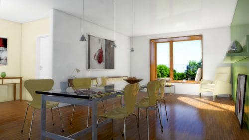 A modern dining area featuring a glass-topped table surrounded by yellow chairs. In the background, there is a large window with a view of lush greenery, and light streams in, illuminating the space. Art pieces decorate the walls.