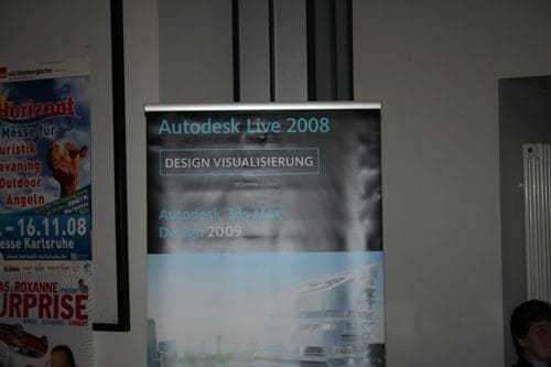 A vertical banner for Autodesk Live 2008 advertising design visualization, featuring the text "Autodesk 3ds Max Design 2009" along with an abstract graphic representation of a futuristic building design.