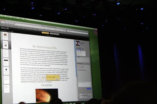 A large screen displays a document titled "An Autonomous EDL" at a presentation, with text visible on the screen, while silhouettes of an audience can be seen in the foreground.