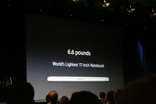 A presentation slide showcasing a lightweight notebook, displaying the text '6.6 pounds' and 'World's Lightest 17-inch Notebook,' with an audience visible in the foreground.