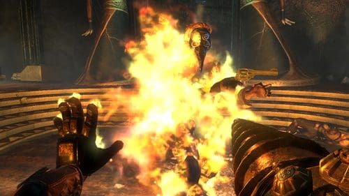 A character wielding a mechanical arm is shooting flames in a dimly lit environment, with flames engulfing a creature in front of them. The backdrop features ancient statues and scattered debris on the ground.