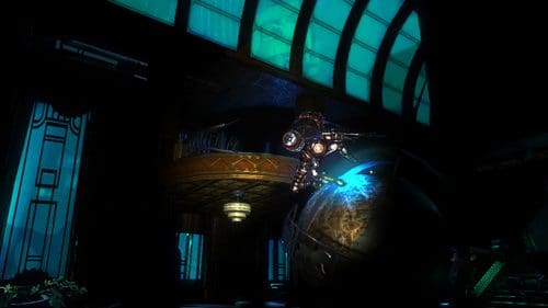 A futuristic, dimly lit interior showcasing a large metallic sphere with glowing details. An intricate structure with a curved ceiling and blue-tinted windows enhances the atmosphere, while a figure in a mechanical suit hovers above the sphere.