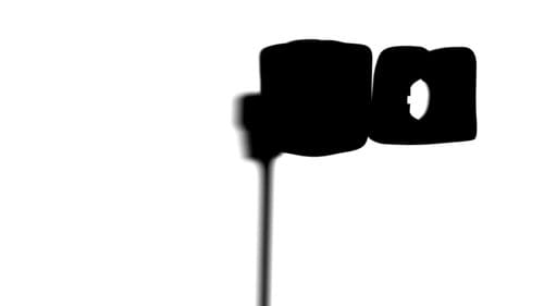 A silhouette of a vintage camera with a flash, displayed against a white background. The outline is dark, highlighting the camera's distinct shapes and contours, creating an abstract representation of photography.