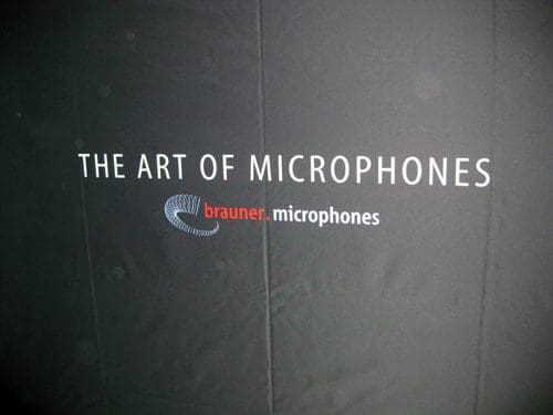 A black background featuring the text 'THE ART OF MICROPHONES' in white, and 'brauner.microphones' in red with a stylized logo. The overall design emphasizes a professional branding for audio equipment.