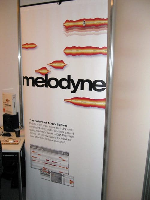 A vertical banner displaying the logo and tagline for Melodyne, a music production software, with graphic visualizations of audio waveforms in red and orange colors.