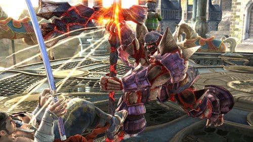 In a dynamic fighting scene, a large, heavily armored character swings a weapon down toward a smaller opponent on the ornate floor of a fantasy arena, with bright visual effects accentuating the action.
