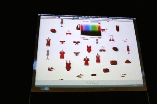 A digital display showcasing a collection of red clothing items and accessories, including dresses, shoes, and bags, arranged in a grid layout with a color selection tool visible at the top.