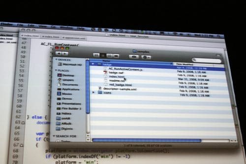A computer screen displaying a file explorer window with a list of files, including 'badge.net', 'index.html', and 'description-sample.xml', along with a string of code visible in the background.