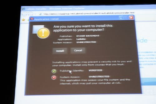 A computer screen displaying a pop-up dialog box titled 'Application Install'. It asks if the user wants to install an application from the publisher 'KNAUF BAIMETEN', with options to 'Install' or 'Cancel', and details about security risks.