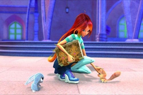 An animated girl with long red hair kneels on a stone floor, interacting with a cute squirrel and a fluffy bunny. She holds a decorative book in one hand, wearing a striped shirt and blue pants. A colorful palace backdrop is visible.