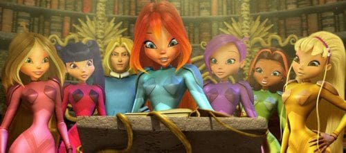 A group of animated characters, each wearing brightly colored costumes, gathers around an ancient book on a stone pedestal in a vast library. Their expressions indicate curiosity and excitement.