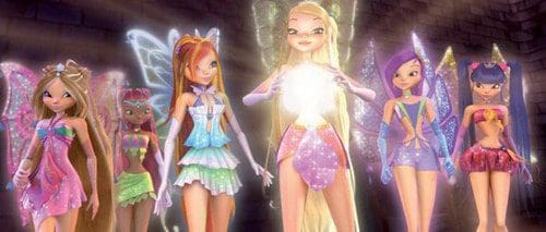 A group of six colorful, stylized fairy characters standing together, each with unique outfits and wings, in a magical setting that enhances their vibrant appearance. They are posing with a glowing orb at the center.