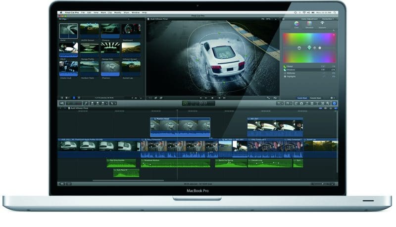 A MacBook Pro displaying video editing software with clips of a car.