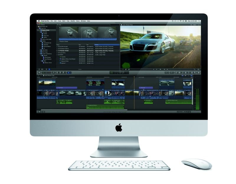 An iMac displaying video editing software interface with car footage.