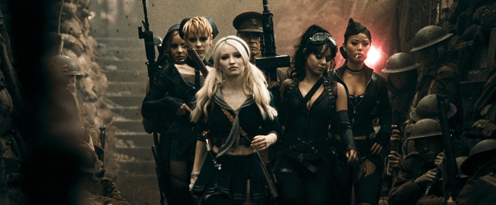 A group of women in military-style outfits walking confidently through a war-torn environment.