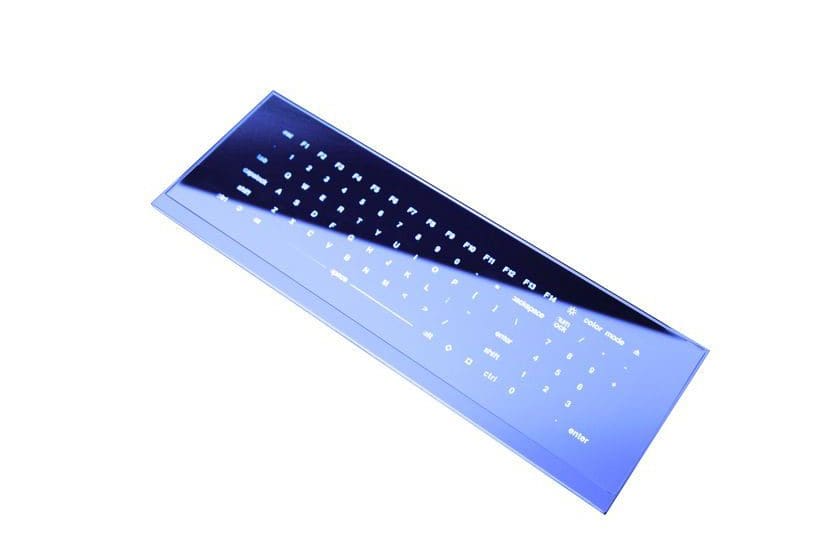 A sleek black keyboard with glowing keys on a white background.